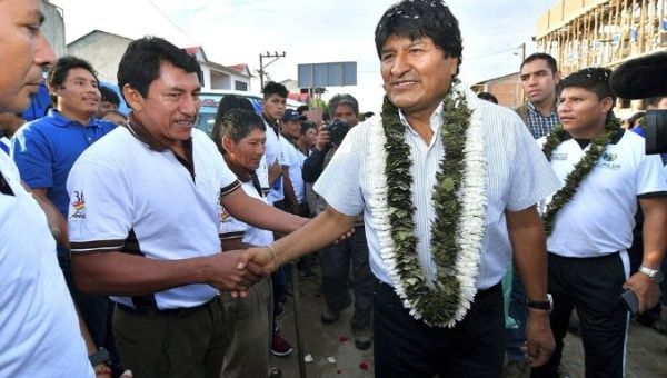 President Evo Morales (C) greets supporters before voting in Villa 14 de Septiembre, Bolivia, during the general elections on Oct. 20, 2019. 