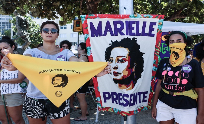 Brazilian women carry Marielle's image in Women's Day demonstrations