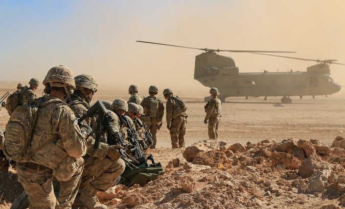 Soldiers get ready to board a CH47 Chinook during  a live-fire training exercise in Iraq, October 31, 2018.