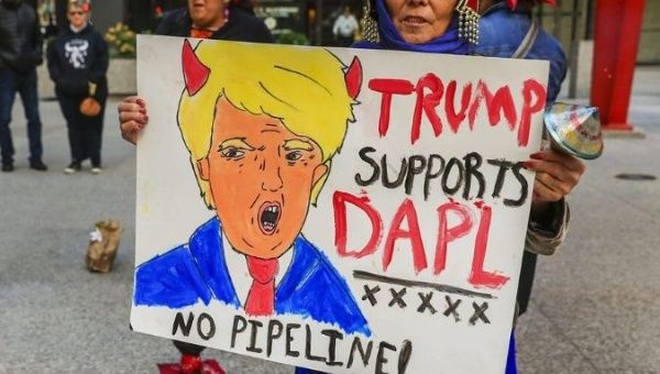 Native Americans are joined by anti-Trump and other protesters Saturday in Chicago as they march in opposition to the Dakota Access Pipeline.