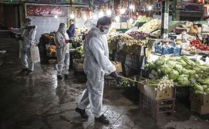 Volunteers disinfect a bazaar in Tehran, Iran, on March 31, 2020