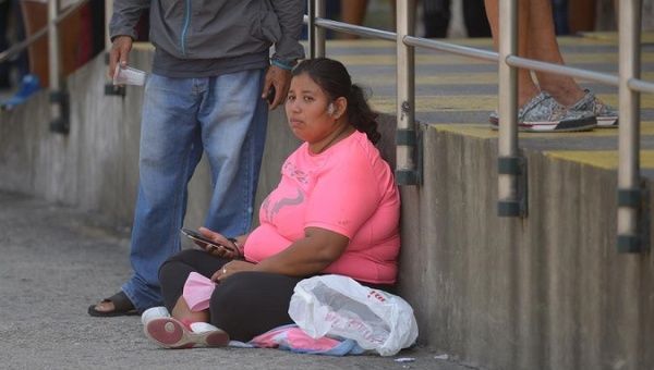 A woman waits outside the Jose Rodriguez Infectology Hospital, Guayaquil, Ecuador, April, 03, 2020.