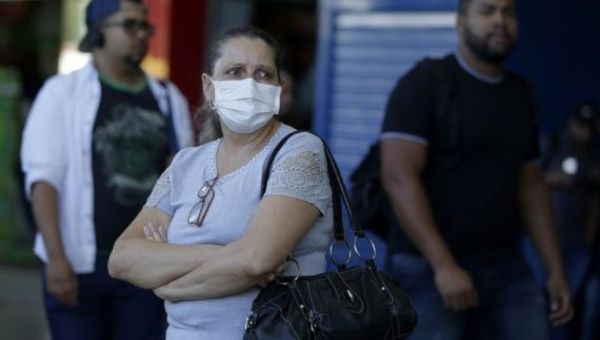 A passenger wearing a face mask is seen at a bus station in Brasilia, Brazil, on March 17, 2020.