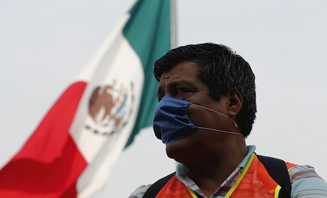 Construction workers request help from the Mexican government outside the National Palace, Mexico city, Mexico, April 17, 2020.