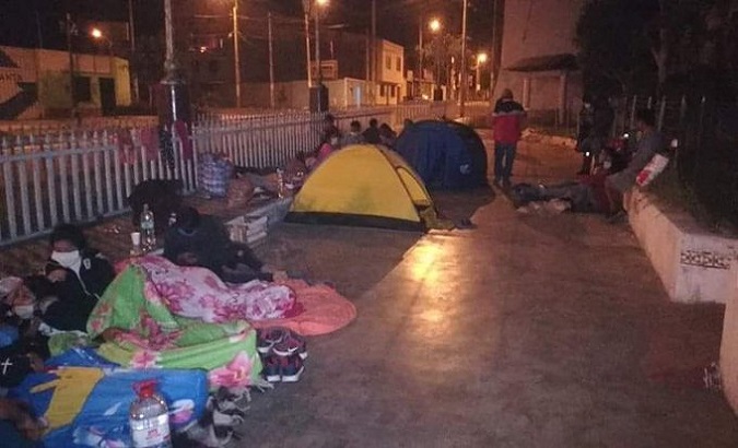 Walkers spending the night outside the Hotel el Condado, Lima, Peru. April 2020.