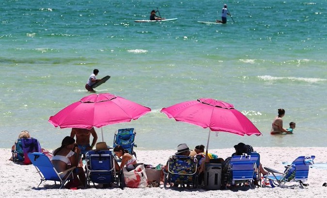 Vacationers use Gulf Place's beach in South Walton County, Florida, U.S. May 4