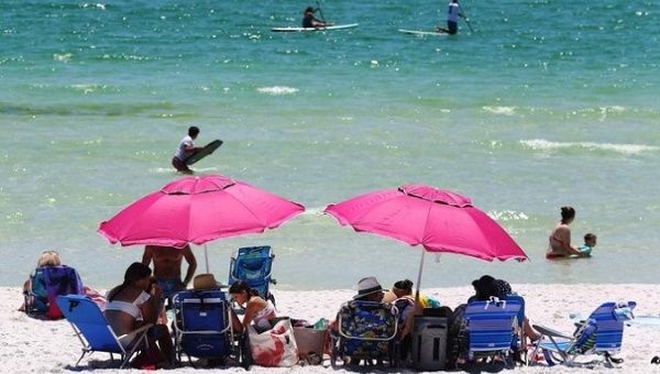 Vacationers use Gulf Place's beach in South Walton County, Florida, U.S. May 4