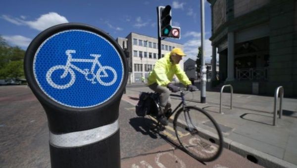 A man rides along a cycle lane in Manchester, Britain, on May 14, 2020.
