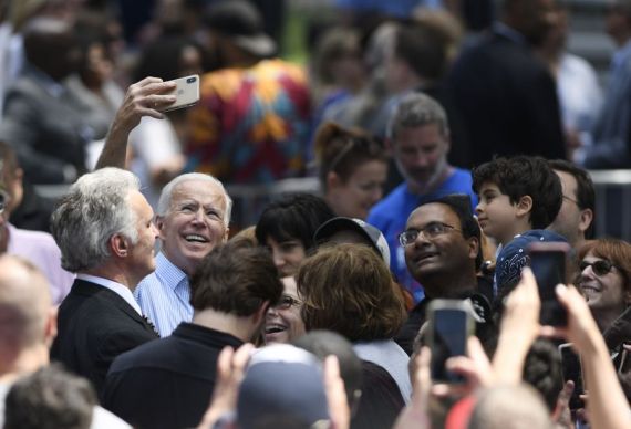 Former U.S. Vice President Joe Biden takes selfie with supporters during a rally in Philadelphia May 18, 2019.