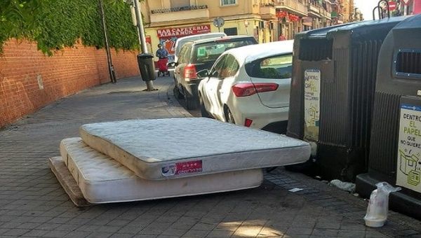 COVID victims' mattresses abandoned on the streets of Madris, Spain. May 26, 2020.