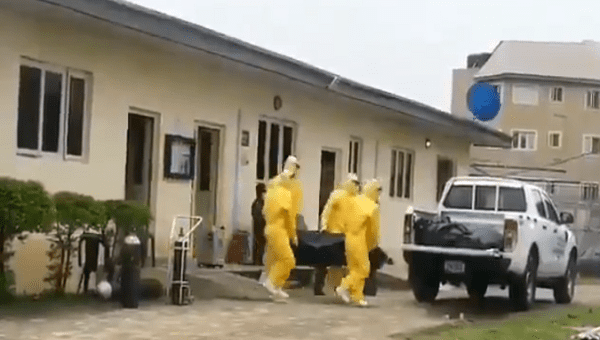 Yaba's Infectious Disease Hospital personnel removes a body. Lagos, Nigeria. June 3, 2020.