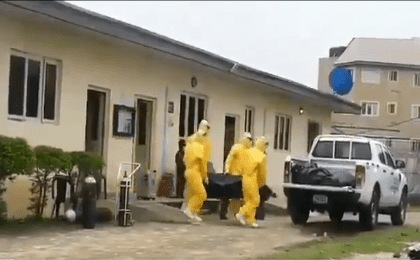 Yaba's Infectious Disease Hospital personnel removes a body. Lagos, Nigeria. June 3, 2020.