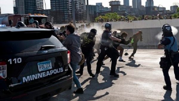Police face citizens protesting against racism, Minneapolis, U.S., May, 2020.