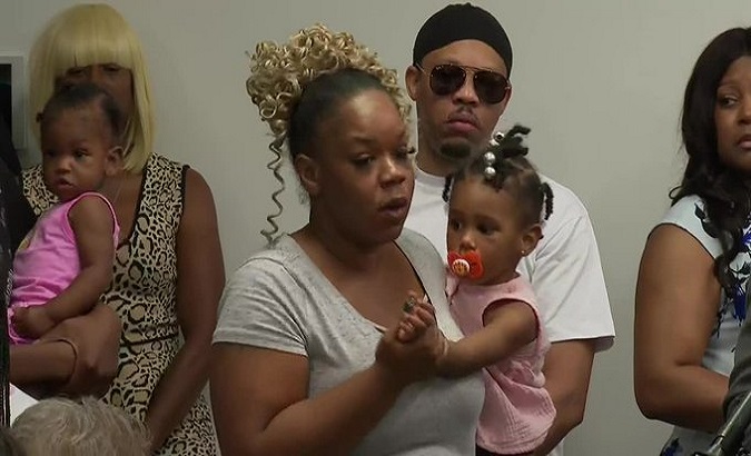 Tomika Miller, Rayshard Brooks’ widow, holding their daughter Memory during family press conference in Atlanta, U.S. June 15, 2020.