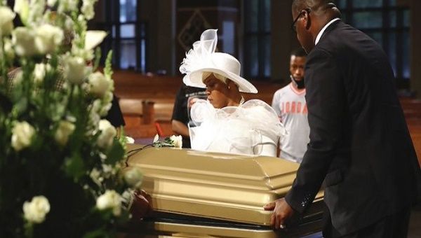 Rayshard Brooks' widow, Tomika Miller, stares at her husband casket in Ebenezer Baptist Church in Atlanta, Georgia. June 23, 2020.