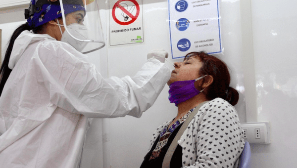 A woman getting tested for COVID-19 in San Miguel of Santiago, Chile. July 7, 2020.