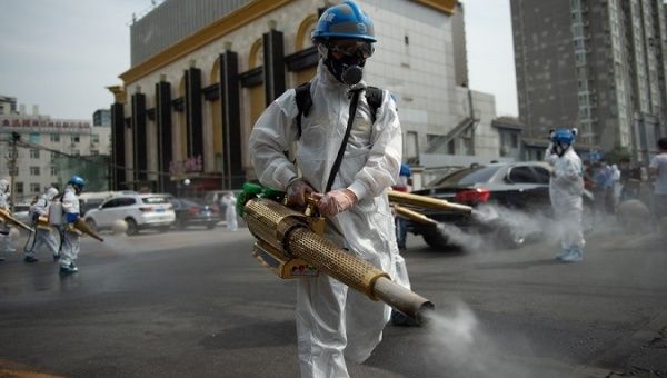 Workers disinfecting the streets in Urumqi City, China, July 21, 2020.