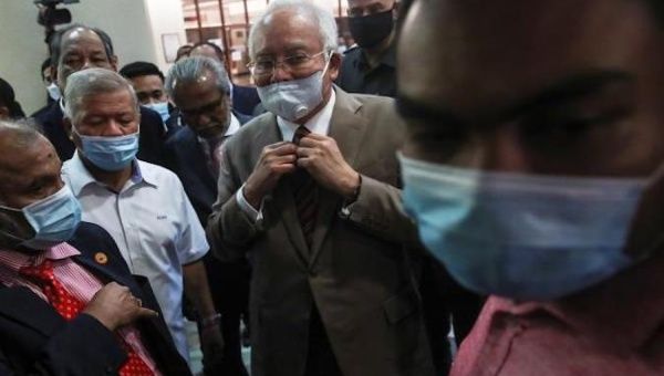 Former Prime Minister Najib Razak (C) leaves the High Court, Kuala Lumpur, Malaysia, July 28, 2020.