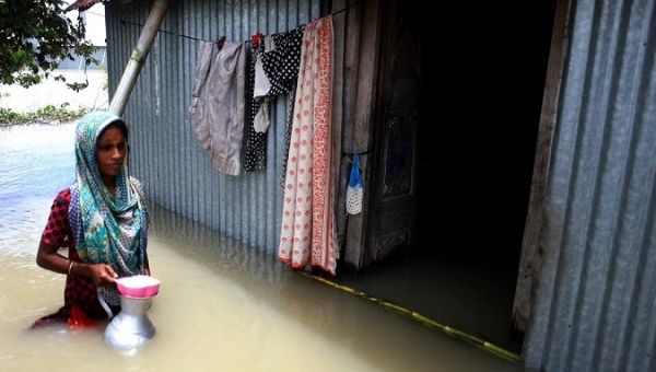 A woman is seen in her flood affected house in Munshiganj on the outskirts of Dhaka, capital of Bangladesh, on July 27, 2020