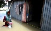 A woman is seen in her flood affected house in Munshiganj on the outskirts of Dhaka, capital of Bangladesh, on July 27, 2020