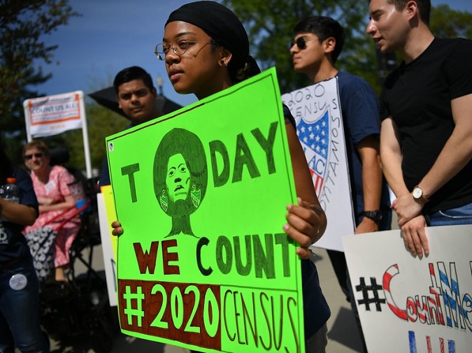 Demonstrators against a proposal to add a citizenship question to the 2020 census protest outside the U.S. Supreme Court in Washington, D.C., April 2019