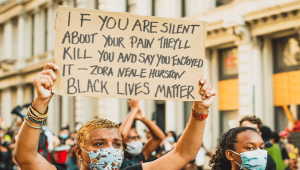 A protester takes to the streets to demand justice for police brutality. 