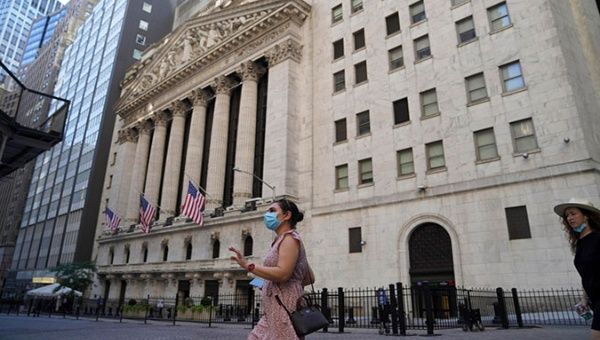 Tourists outside the New York Stock Exchange, New York, U.S., August 2, 2020.