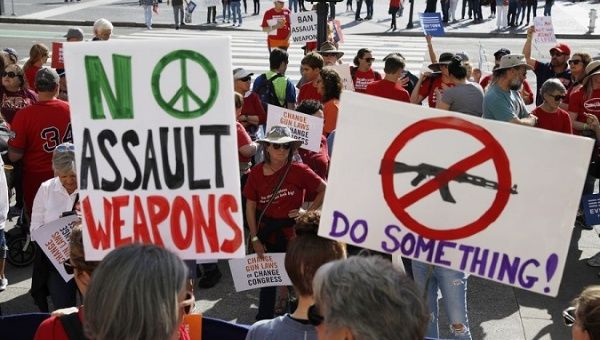 People take part in a rally held in downtown San Francisco to urge the federal government and lawmakers in Congress to take action to control gun-related crimes, August 17, 2019.