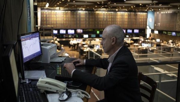 A staff member works at a stock exchange in Buenos Aires, Argentina, August, 28, 2019.
