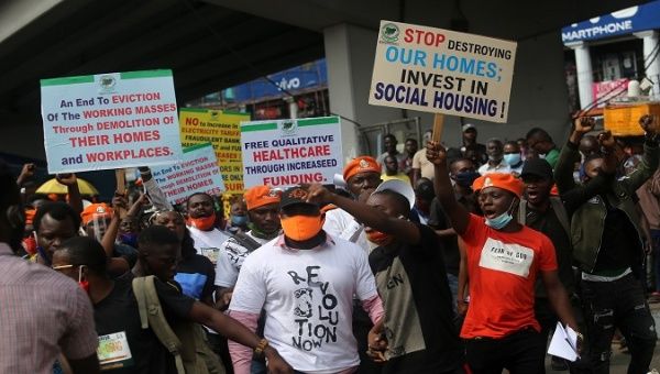 Protesters hold banners and shout slogans during a protest organized by the 'Revolution Now' group in Lagos, Nigeria. August 5, 2020.