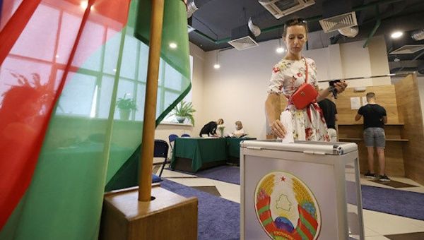 A woman attends the polls in Minsk, Belarus, August 9, 2020.