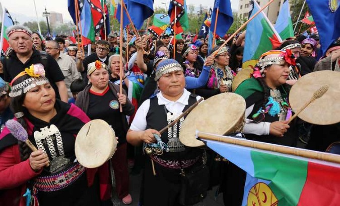 Mapuche community members participate in the 
