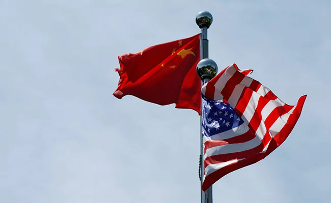 U.S. and China flags waving together.