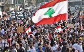 Anti-government protestors gather near the devastated harbor area to commemorate the victims of the explosion that took place in August 4 in Beirut, Lebanon, 11 August 2020.