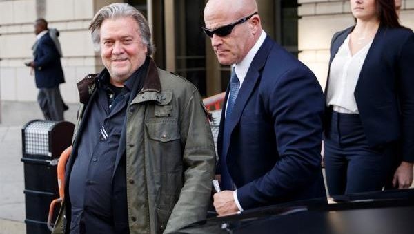 Former White House strategist Steve Bannon (L) departs after testifying at the trial of Roger Stone at the Federal District Court in Washington, DC. November 8, 2019.