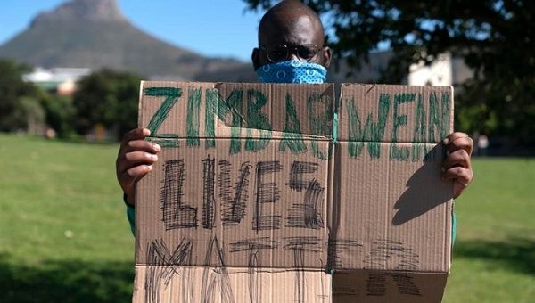 A man protests against a shrinking economy, Cape Town, South Africa, August 7, 2020. 