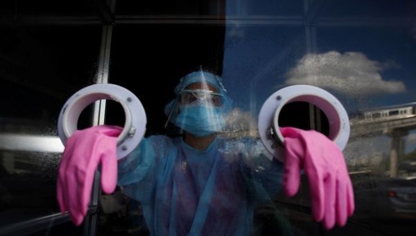 Medical personnel prepare to perform coronavirus swab tests at an express station in the district of San Miguelito in Panama City, Panama. August 25, 2020.