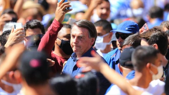 Jair Bolsonaro walks among supporters in Caldas Novas, Goias, Brazil, August 30, 2020.