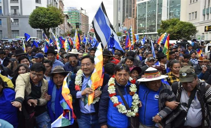 MAS candidate Luis Arce (C) participates in a demonstration in La Paz, Bolivia