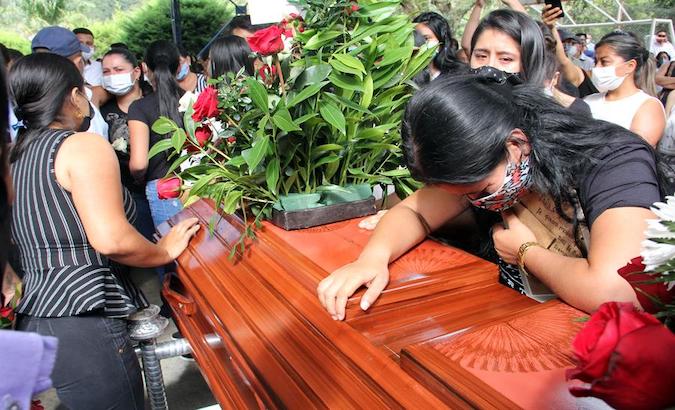 Relatives cry over a coffin of body of Sebastian Quintero, another victim in Samaniego, Colombia), August 17, 2020.