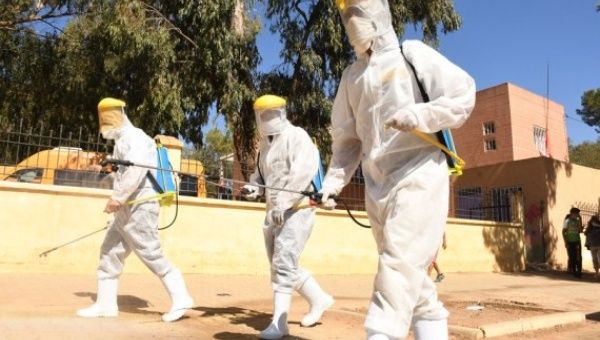 Health workers disinfect a public area in Khemisset, Morocco, on Sept. 10, 2020.