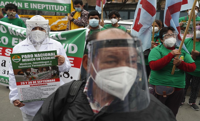 Public healthcare workers protest in Lima, Peru. Sept. 29, 2020.