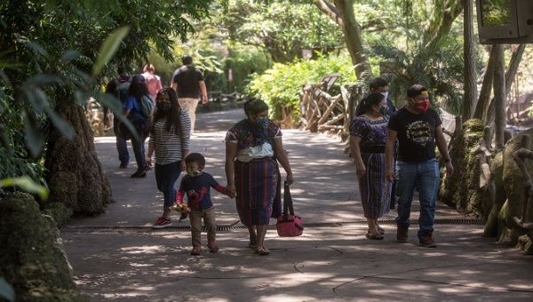Walkers enjoy the trails of an ecological park in Guatemala City, Guatemala. October 7, 2020.
