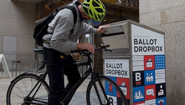 Citizen checks that his ballot was deposited in a ballot box, Boston, U.S., Oct. 26, 2020.