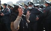A woman reacts during an opposition rally in Yerevan, Armenia, 11 November 2020. Protesters demand the resignation of Armenian Prime Minister Nikol Pashinyan and his government. 