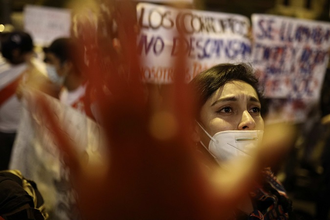 Demonstrators protest outside the Peruvian Congress calling for a new constitution on November 17, after Francisco Sagasti was inaugurated as the country's new president, in Lima (Peru).