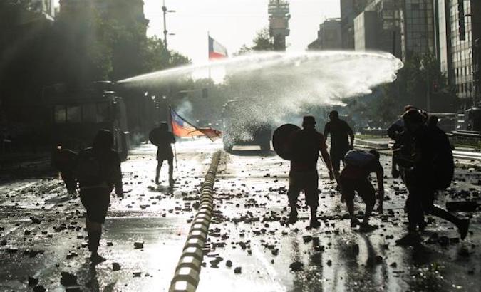 Carabineros police repress a protest in Santiago, Chile, Dec. 4, 2020