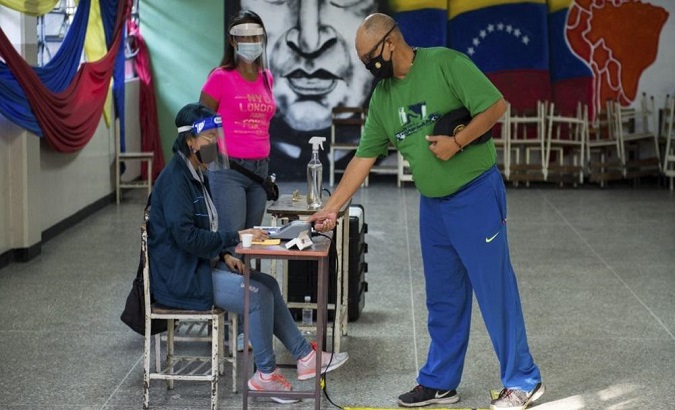A man casts his vote in the parliamentary elections, Venezuela, Dec. 6, 2020.