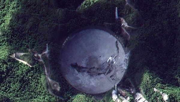 A handout satellite photo made by Maxar shows the damaged radio telescope at the Arecibo Observatory in Puerto Rico, 06 December 2020. 