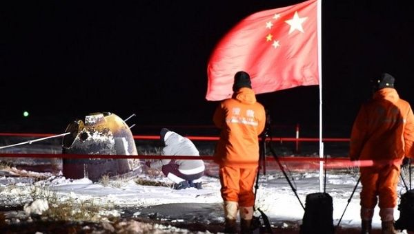 Scientists and technicians at the Change-5 landing site, China, Dec 17, 2020.